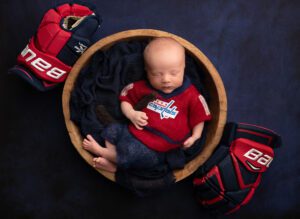 Washington Capitals newborn with dad's hockey gloves