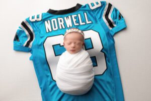 baby on dad's football jersey