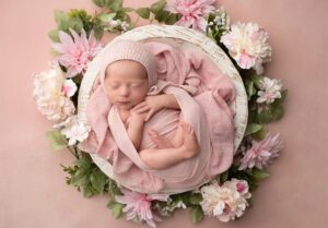 Washington Commanders newborn session baby with pink floral