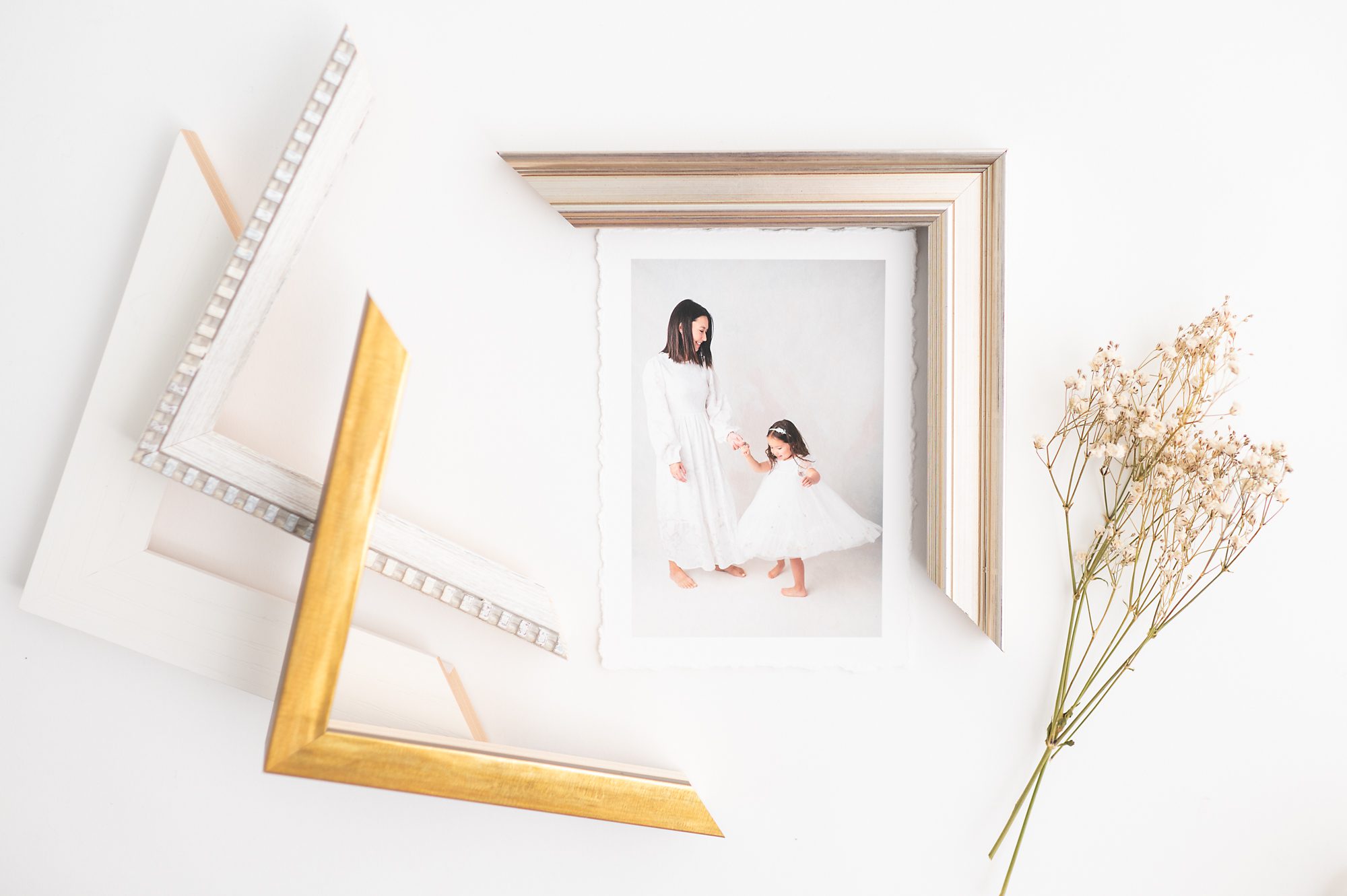 Potomac fine art photographer flat lay photograph of a torn edge fine art print and various framing options 